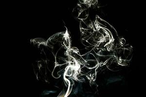 Smoke effect texture. Isolated background. Black and dark backdrop. Smokey fire and mistic effect. photo