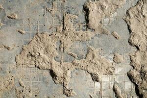 Cracked and abstract grunge texture. Aged material surface backdrop. Weathered effect pattern. Old and dirty background. photo