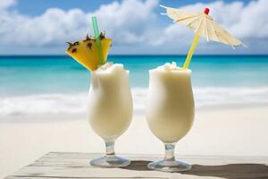 Two summer coconut milk cocktails with a slice of pineapple on the table on a sunny beach. Pina colada. . photo