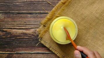 homemade ghee in container on a table video