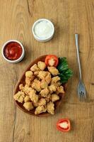 Crispy Popcorn Chicken with Mayonaise and Chilli Sauce. photo