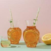 Lemon Ice Tea on Two Carafe Glass photo