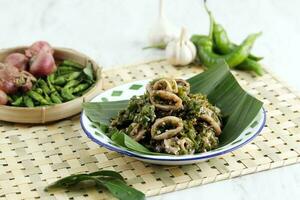 Cumi Cabe Ijo, Spicy Stir Fry Squid with Green Pepper, Shallot, and Garlic. photo
