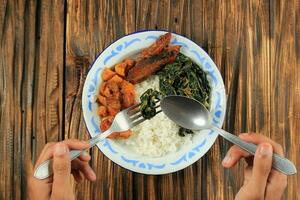 Eat Nasi Warteg Menu, Steamed White Rice with Various Side Dish photo