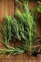 Fresh Rosemary on Wooden Table photo