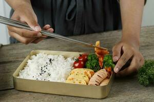 Put Kimchi to Korean Packed Lunchbox photo