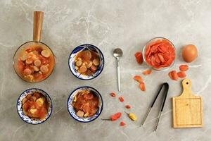Seblak Bandung, Spicy Stew made from Stir Fry Cracker with various Topping. photo