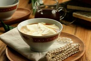 Tau Huay or Douhua. Chinese Soft Soybean Pudding with Sugary Water. photo