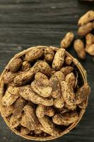 Fresh Harvest Ground Peanut on Rattan Bowl photo