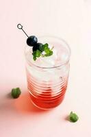 Red Syrup with ICe Cubed, Topping with Blueberry and Mint Leaf photo