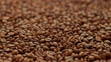 full frame looped spinning background of roasted coffee beans video