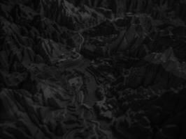 Black and white paper cut terrain background created with technology. photo