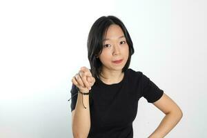 Young attractive south east asian woman pose face expression emotion on white background point finger photo