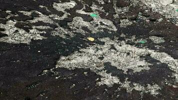 War in Ukraine. Funnel from the explosion in the asphalt. The trace left by the explosion of an artillery shell. Consequences of the rocket attack. Attack of Iranian drones. video