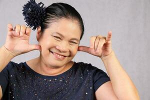 Elderly senior Asian woman posing facial expression photo