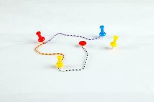 Colorful Paper board pin clip on white background route map photo