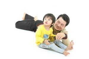 South East Asian young father mother daughter son parent boy girl child activity photo