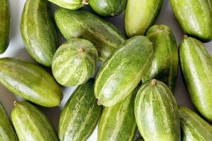 pointed gourd potol green vegetable on white background photo