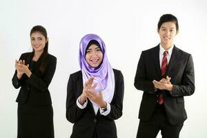 South East Asian young Malay Chinese Indian man woman wearing headscarf formal business office ware on white background stand clap hands cheer congratulate photo