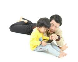 South East Asian young father mother daughter son parent boy girl child activity indoor photo