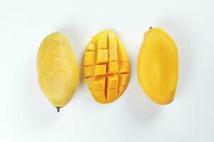 ripe yellow mango cut slice whole on white background photo