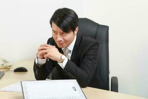 Young Asian man woman wearing business office suit chair table computer white background photo