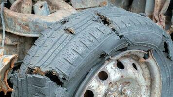 The police shot through the wheel while chasing the offender. Bullet hole in a wheel tire close-up. photo