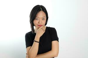 Young attractive south east asian woman pose face expression emotion on white background think finger in mouth photo