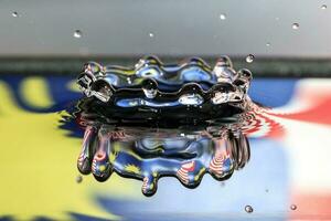 Water droplet drop splash collision dripping pillar Malaysia Flag reflection refraction independence country patriot photo