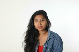 Young attractive Asian Indian woman pose face body expression mode emotion on white background look at camera photo