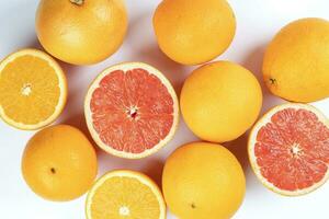 Orange grapefruit slice closeup on white background photo