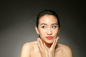 Young beautiful Asian woman facial expression photo