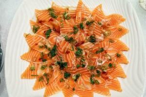 Marinated Salmon shashimi on ice at buffet photo