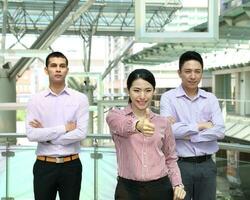 Young south east Asian middle eastern man woman business colleague outdoor stand pose photo