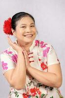 Elderly senior Asian woman posing facial expression photo