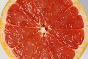 Ruby red grapefruit cut closeup photo