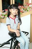 South East Asian young father mother daughter  parent girl child activity indoor photo