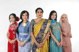 South east Asian Malay Chinese Indian race ethnic origin woman wearing dress costume baju kurung cheongsam samfu kebaya Sharee multiracial community on white background photo