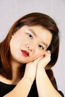 Young attractive southeast Asian woman posing facial expression photo