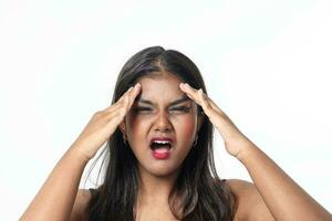 Young attractive Asian Indian woman pose face body expression mode emotion on white background headache hand on forehead photo