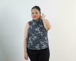 Young plus size south east asian woman pose face expression emotion on white background photo