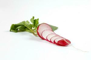 Small red radish on white background photo