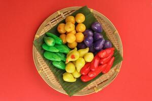 Colourful Luk chup look choop tadeonal Thai desert sweets candy creatve variety bamboo plate banana leaf photo