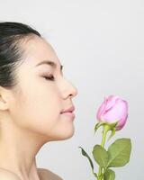 Young beautiful Southeast Asian woman beauty fashion makeup light grey white background photo