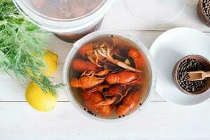 Homemade Crawfish in plastic buckets on kitchen counter, food delivery photo