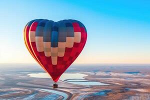heart shaped Hot Air Balloon with unrecognizable people in the sky, photo