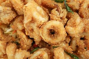 Thai style salted squid calamari fried with salted egg batter photo