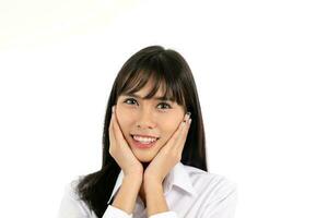 Facial Expression Young Asian woman office attire white background hand on face cheek photo