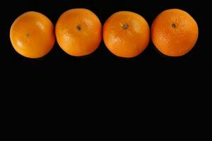 Orange Fruit top view black background photo