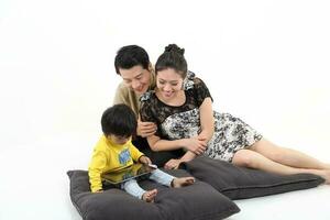 South East Asian young father mother daughter son parent boy girl child activity indoor photo